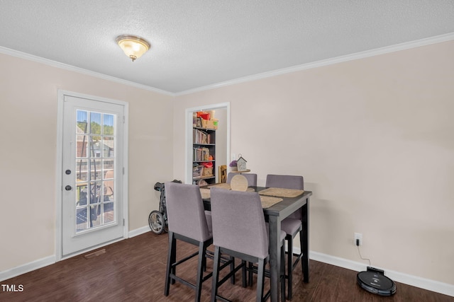 117 James Dr, Pine Level, NC 27568 - dining area with a textured ceiling, crown molding, and dark wood-type flooring
