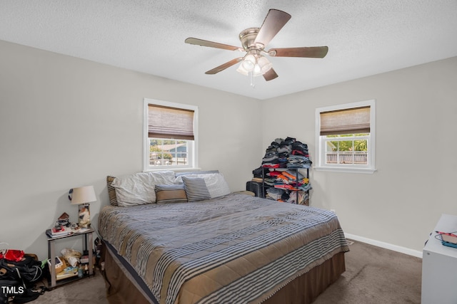 117 James Dr, Pine Level, NC 27568 - carpeted bedroom featuring a ceiling fan and a textured ceiling