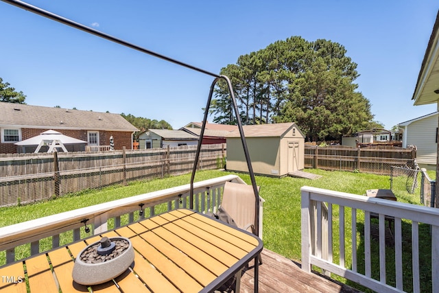 117 James Dr, Pine Level, NC 27568 - deck with a fenced backyard, a storage unit, a residential view, and outdoor dining area