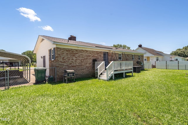 117 James Dr, Pine Level, NC 27568 - rear view of property featuring brick siding, a chimney, and a deck