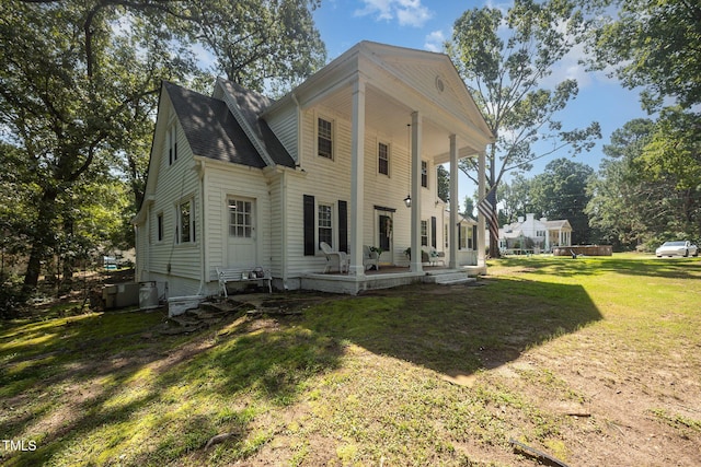 900 Beaman St, Clinton, NC 28328 - rear view of property featuring a porch and a yard