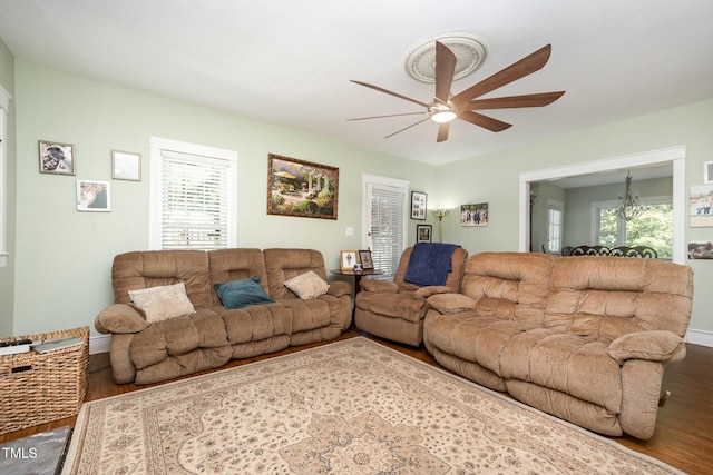 900 Beaman St, Clinton, NC 28328 - living area featuring a ceiling fan, wood finished floors, and plenty of natural light