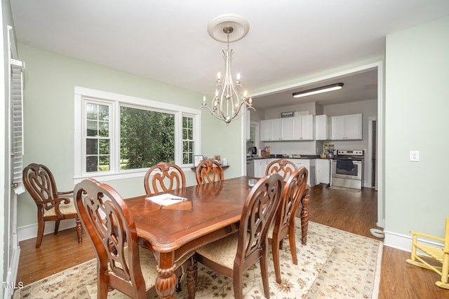 900 Beaman St, Clinton, NC 28328 - dining space with a chandelier and wood finished floors