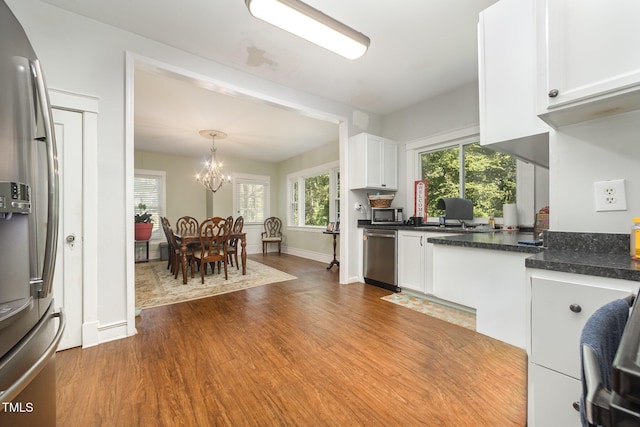 900 Beaman St, Clinton, NC 28328 - kitchen with stainless steel appliances, dark wood-style floors, white cabinetry, and dark countertops