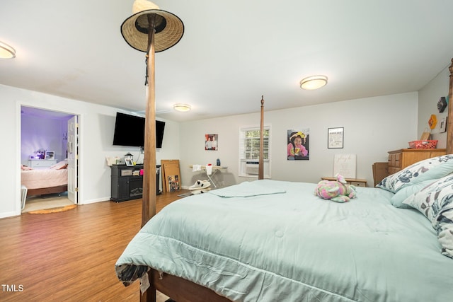 900 Beaman St, Clinton, NC 28328 - bedroom featuring wood finished floors and cooling unit