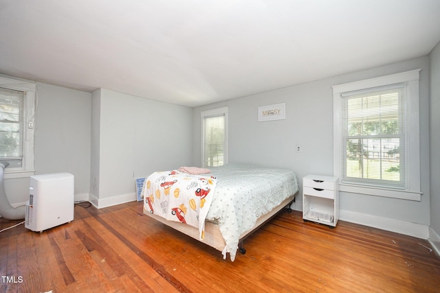 900 Beaman St, Clinton, NC 28328 - bedroom with wood finished floors and baseboards