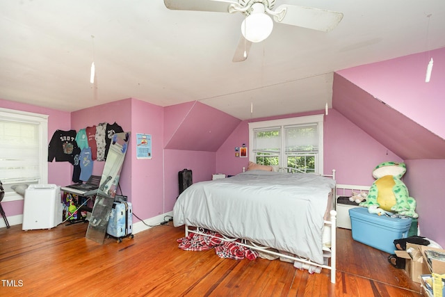 900 Beaman St, Clinton, NC 28328 - bedroom featuring wood finished floors, vaulted ceiling, and a ceiling fan
