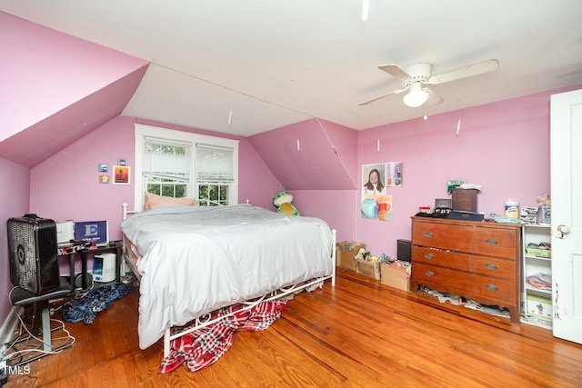 900 Beaman St, Clinton, NC 28328 - bedroom featuring wood finished floors, vaulted ceiling, and a ceiling fan
