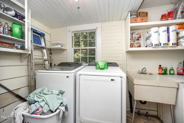 900 Beaman St, Clinton, NC 28328 - laundry area with separate washer and dryer, wood ceiling, and wooden walls