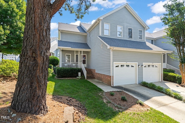 8221 Hempshire Pl Unit 101, Raleigh, NC 27613 - traditional-style home with a porch, concrete driveway, an attached garage, a front yard, and roof with shingles