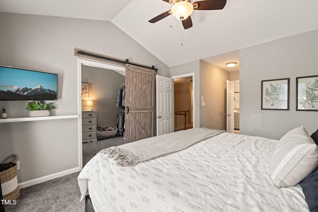 8221 Hempshire Pl Unit 101, Raleigh, NC 27613 - bedroom with a barn door, carpet floors, vaulted ceiling, and ceiling fan