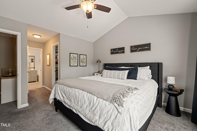 8221 Hempshire Pl Unit 101, Raleigh, NC 27613 - bedroom featuring carpet flooring, vaulted ceiling, a spacious closet, connected bathroom, and a ceiling fan