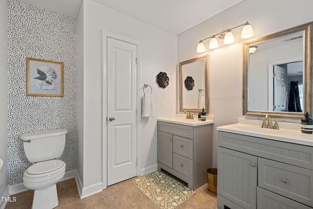 8221 Hempshire Pl Unit 101, Raleigh, NC 27613 - bathroom featuring two vanities and toilet