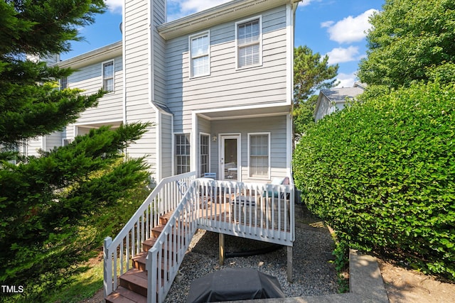 8221 Hempshire Pl Unit 101, Raleigh, NC 27613 - back of house with a chimney and a deck