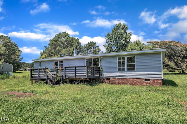 64 Doughty Ln Unit E, Middlesex, NC 27557 - rear view of house with crawl space, a wooden deck, and a lawn