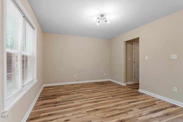 1611 Poole Rd, Raleigh, NC 27610 - empty room featuring light wood-style floors and baseboards