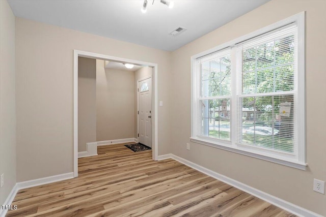 1611 Poole Rd, Raleigh, NC 27610 - spare room with plenty of natural light and light wood-style floors