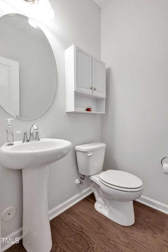 1434 Salem Creek Dr, Apex, NC 27502 - half bathroom with baseboards and wood finished floors