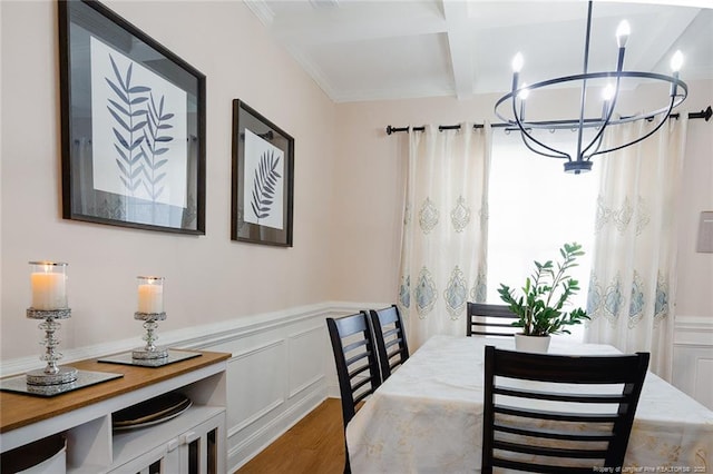688 Townsend Rd, Raeford, NC 28376 - dining area featuring beamed ceiling, wood finished floors, coffered ceiling, a decorative wall, and wainscoting