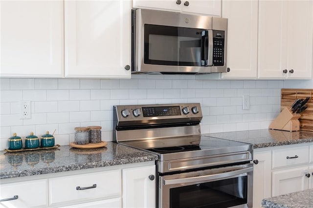 688 Townsend Rd, Raeford, NC 28376 - kitchen featuring appliances with stainless steel finishes, white cabinetry, and tasteful backsplash