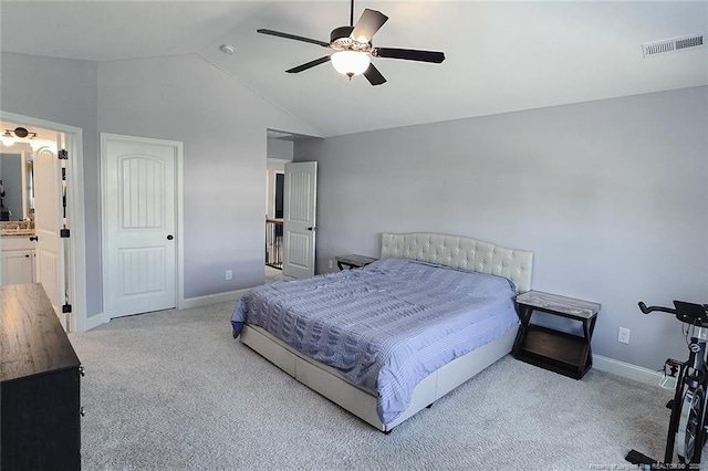 688 Townsend Rd, Raeford, NC 28376 - bedroom featuring carpet floors, vaulted ceiling, ceiling fan, and ensuite bathroom