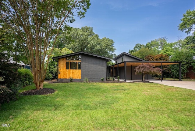 2129 Ridge Rd, Raleigh, NC 27607 - view of front of property featuring concrete driveway, a front lawn, and an attached carport