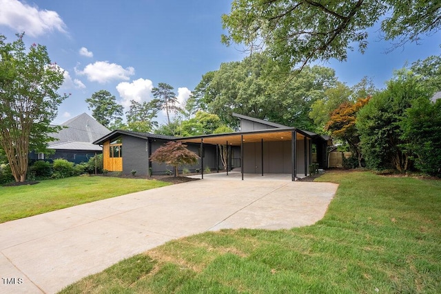 2129 Ridge Rd, Raleigh, NC 27607 - mid-century inspired home featuring driveway, board and batten siding, and a carport