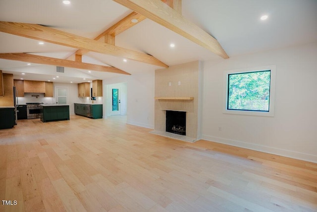 2129 Ridge Rd, Raleigh, NC 27607 - unfurnished living room with a large fireplace, recessed lighting, and light wood-type flooring