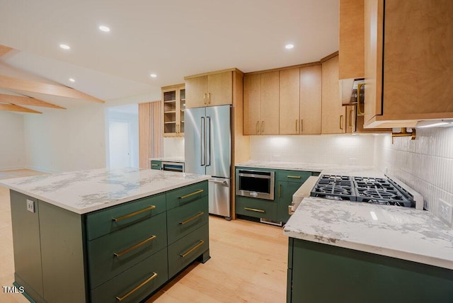2129 Ridge Rd, Raleigh, NC 27607 - kitchen with green cabinetry, high end refrigerator, a center island, decorative backsplash, and recessed lighting