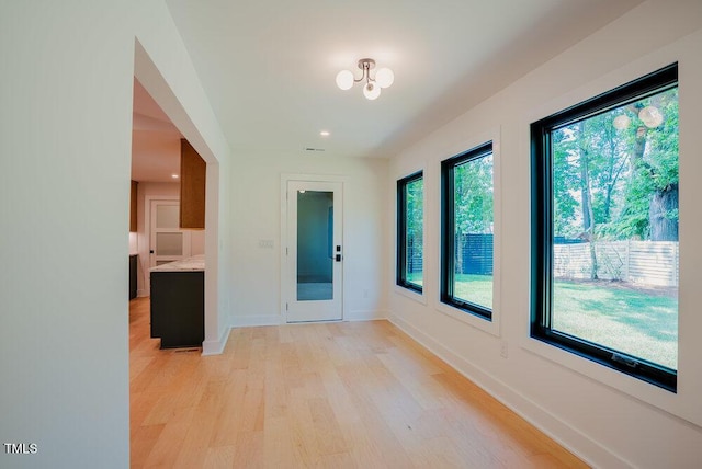 2129 Ridge Rd, Raleigh, NC 27607 - hall with light wood-style floors, recessed lighting, and a chandelier