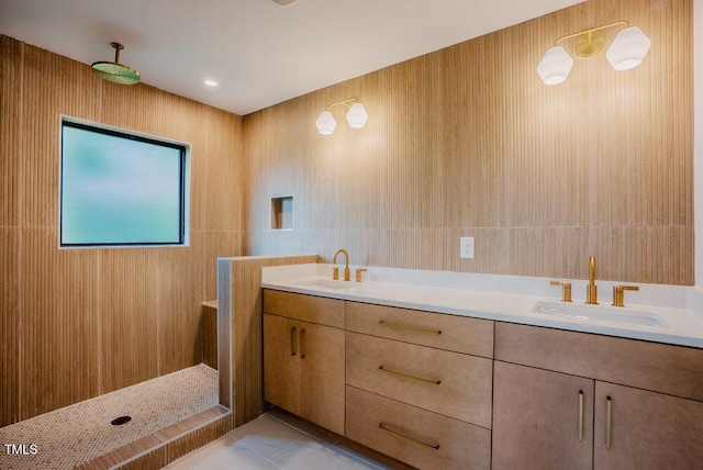 2129 Ridge Rd, Raleigh, NC 27607 - bathroom featuring marble look tiles, double vanity, and a tile shower