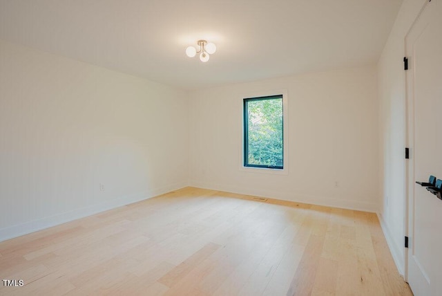 2129 Ridge Rd, Raleigh, NC 27607 - empty room with light wood finished floors and baseboards