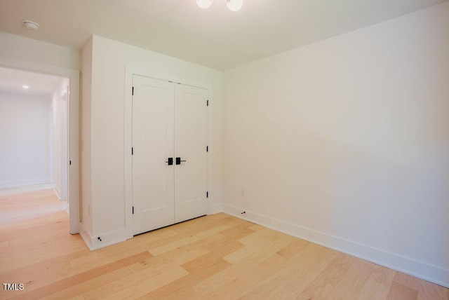 2129 Ridge Rd, Raleigh, NC 27607 - unfurnished bedroom with light wood-style flooring and a closet
