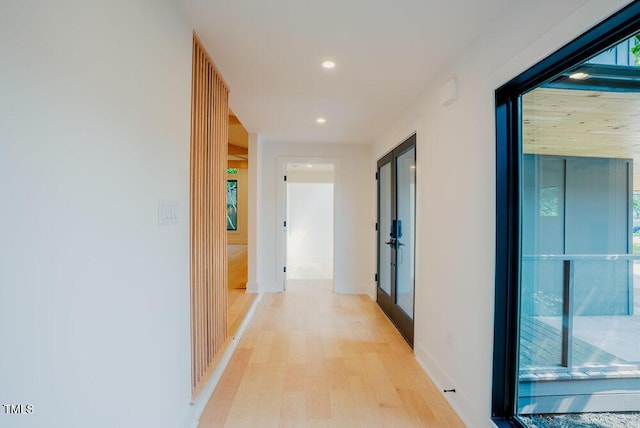 2129 Ridge Rd, Raleigh, NC 27607 - hall with french doors, light wood-style floors, and recessed lighting