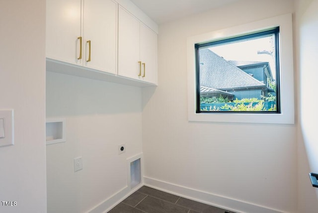 2129 Ridge Rd, Raleigh, NC 27607 - washroom featuring cabinet space, electric dryer hookup, and dark tile patterned floors
