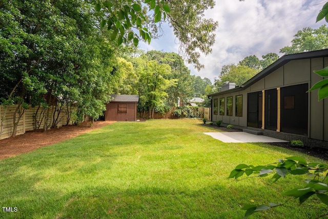 2129 Ridge Rd, Raleigh, NC 27607 - fenced backyard with a storage shed and a patio