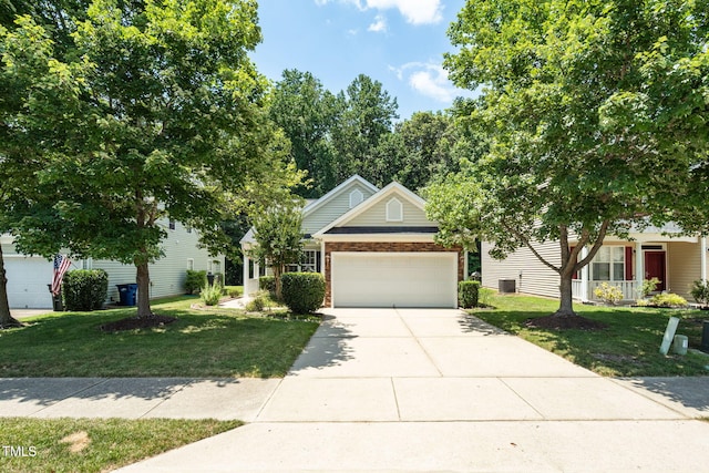 7807 Braefield Dr, Raleigh, NC 27616 - obstructed view of property with a front yard, a garage, driveway, and brick siding