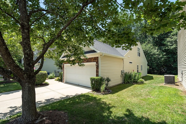 7807 Braefield Dr, Raleigh, NC 27616 - view of side of property featuring a yard, concrete driveway, a garage, and roof with shingles
