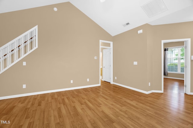 7807 Braefield Dr, Raleigh, NC 27616 - empty room featuring light wood-style floors and high vaulted ceiling