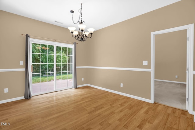 7807 Braefield Dr, Raleigh, NC 27616 - empty room with a chandelier and light wood-type flooring
