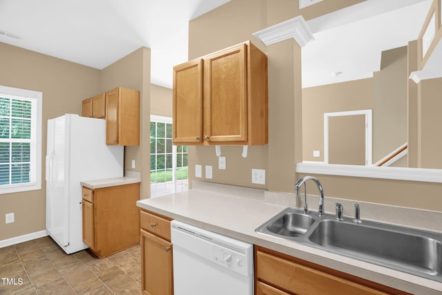 7807 Braefield Dr, Raleigh, NC 27616 - kitchen featuring white appliances, healthy amount of natural light, and light countertops