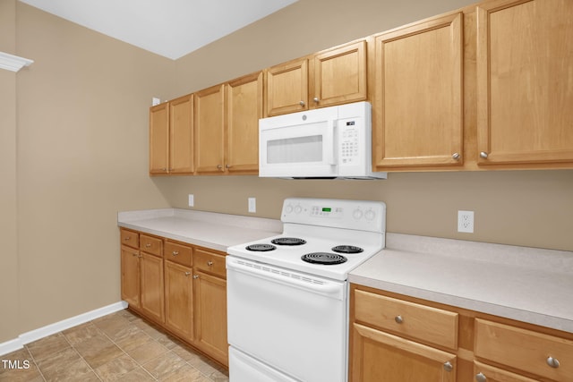 7807 Braefield Dr, Raleigh, NC 27616 - kitchen featuring white appliances, light countertops, and light brown cabinets