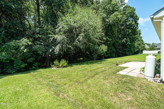 7807 Braefield Dr, Raleigh, NC 27616 - view of green lawn with a patio area
