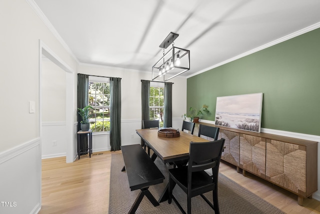 2704 Farnborough Rd, Raleigh, NC 27613 - dining space featuring light wood-style floors and ornamental molding