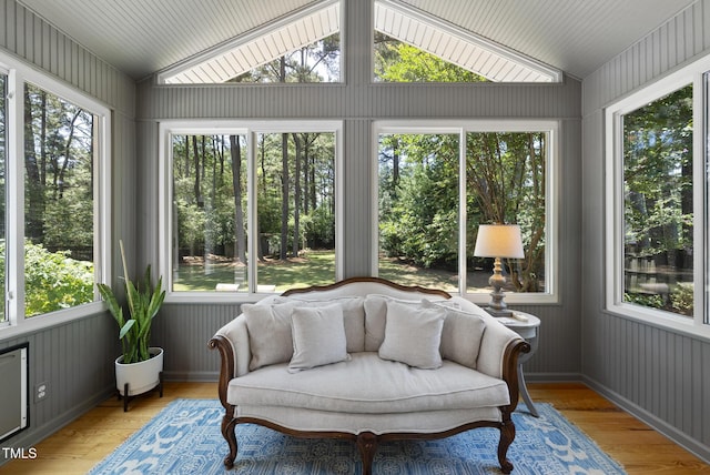 2704 Farnborough Rd, Raleigh, NC 27613 - sunroom / solarium with lofted ceiling, wood finished floors, wood walls, and plenty of natural light