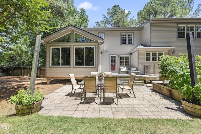 2704 Farnborough Rd, Raleigh, NC 27613 - rear view of house featuring a patio and outdoor dining space