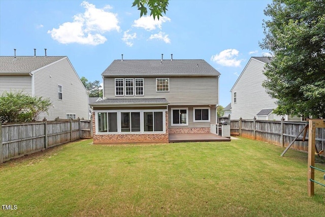 7414 Brandon Allen Ave, Raleigh, NC 27613 - back of house with brick siding, a fenced backyard, a deck, and a shingled roof
