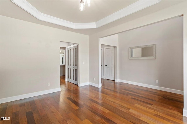 7414 Brandon Allen Ave, Raleigh, NC 27613 - empty room with ornamental molding, hardwood / wood-style floors, and a raised ceiling