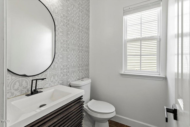 7414 Brandon Allen Ave, Raleigh, NC 27613 - half bath featuring wallpapered walls and vanity