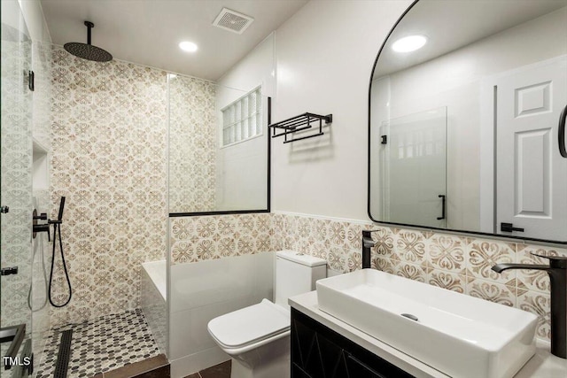 7414 Brandon Allen Ave, Raleigh, NC 27613 - full bath featuring tile walls, a walk in shower, recessed lighting, vanity, and wainscoting